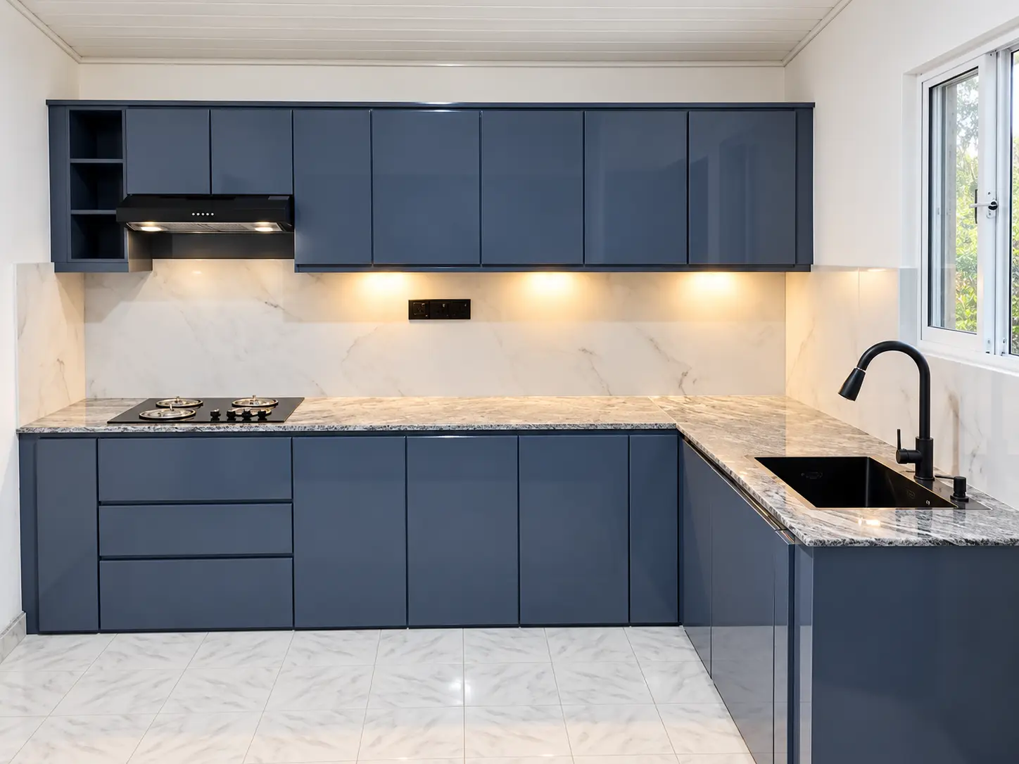 L-shaped blue grey kitchen with stone worktops